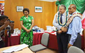 Fiji's health minister, Jone Usamate (right), and Dr Laurent Zessler of the UNPA (left).