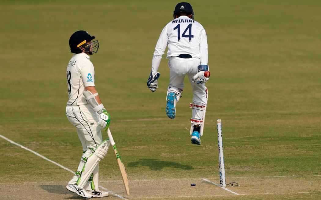 K.S.Bharat wicket-keeper of India stumped out Tom Latham of New Zealand
