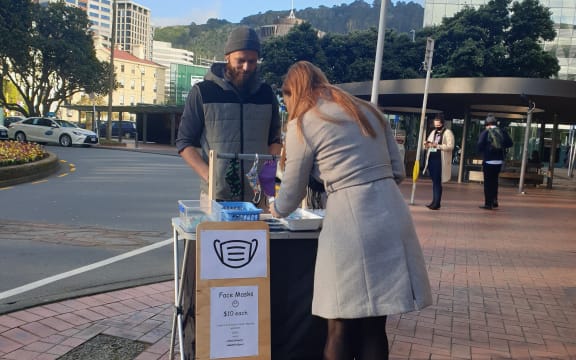 Cam, who's been selling masks made by his wife in Wellington.