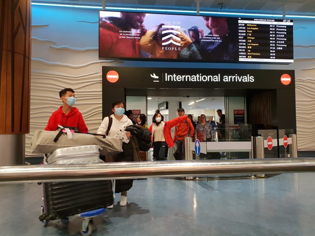 Passengers from international flights at Auckland Airport on Monday 27 January, after flights from Guangzhou and Shanghai had touched down. Some people were wearing masks.