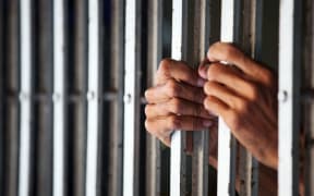 hand in jail