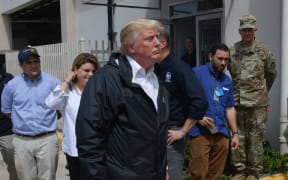 US President Donald Trump visits residents west of San Juan, Puerto Rico, nearly two weeks after Hurricane Maria hit territory.
