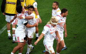 Chiefs celebrate a James Lowe try.