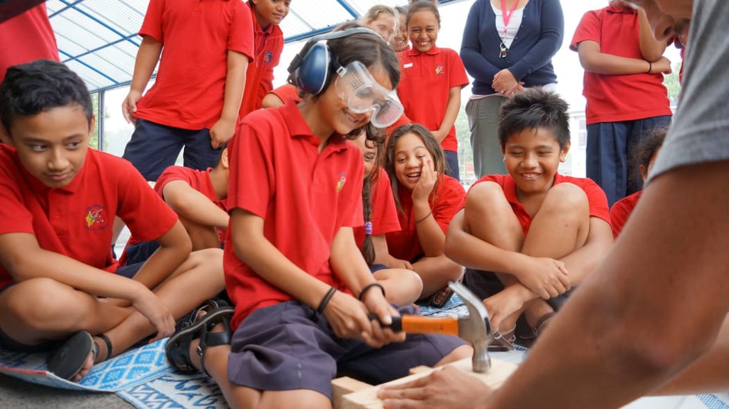 Children working on a Roots project