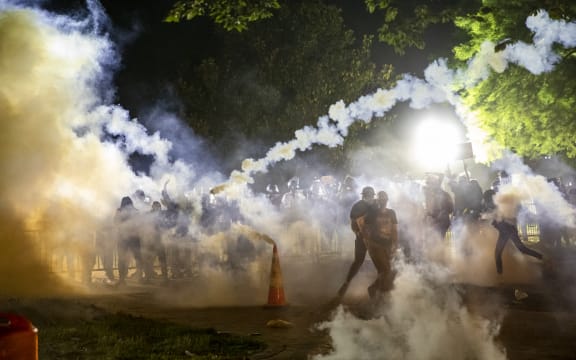 Tear gas rises as protesters face off with police during a demonstration outside the White House on 31 May over the death of George Floyd at the hands of Minneapolis Police.