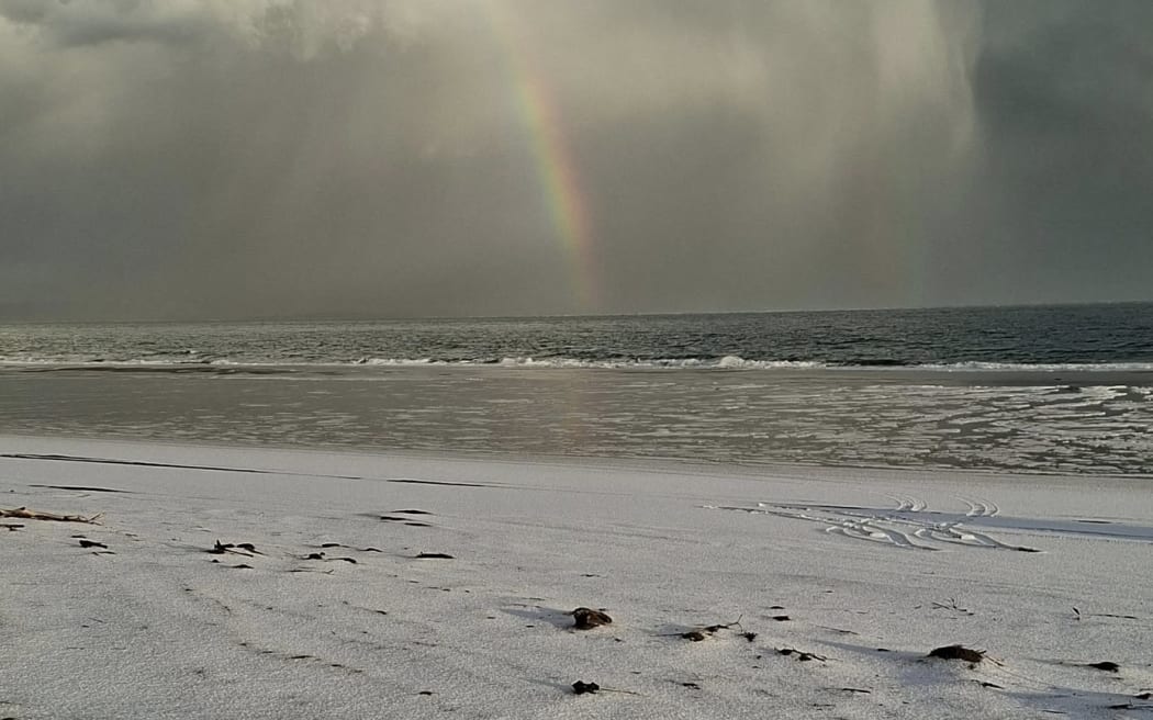 The beach at Pouto, south of Dargaville, is blanketed in ice after a freak hail storm.