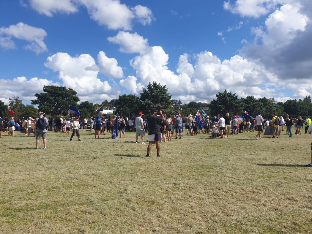 Anti-mandate protesters gather at Onepoto Domain on the North shore as they prepare to march across the Auckland Harbour Bridge.