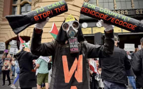 Crowds gathered at Flinders Street Station in Melbourne on Monday in opposition to Israeli President Isaac Herzog’s visit to Australia.