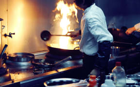 motion chefs of a restaurant kitchen