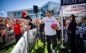 Charlie Kirk hands out hats before speaking at Utah Valley University in Orem, Utah, on 10 September.