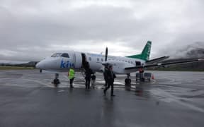 Passengers disembark from Kiwi Regional Airlines Flight KRL 1 in Queenstown, after arrival from Dunedin.