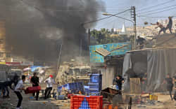 Palestinians clash with Israeli security forces during a raid in the occupied West Bank city of Nablus, on February 22, 2023.