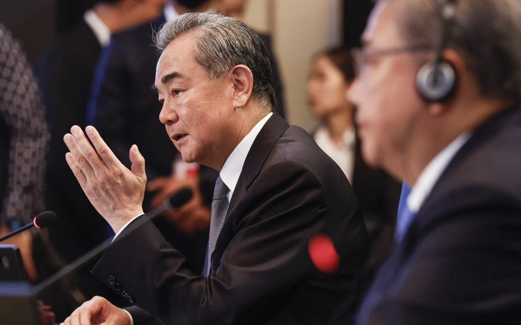 (FILES) Director of the Office of the Foreign Affairs Commission of the Communist Party of China’s Central Committee Wang Yi (L) speaks as South Korea's Foreign Minister Park Jin looks on during the Association of Southeast Asian Nations (ASEAN) Plus Three Foreign Ministers’ Meeting in Jakarta on July 13, 2023. State media outlet Xinhua said on July 25 evening that China's top legislature had voted to remove Qin from office and replace him with his boss Wang Yi. (Photo by MAST IRHAM / POOL / AFP)