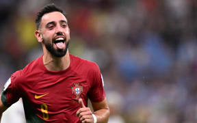Portugal's midfielder Bruno Fernandes celebrates scoring his team's second goal during the Qatar 2022 World Cup Group H football match between Portugal and Uruguay at the Lusail Stadium in Lusail, north of Doha on November 28, 2022.