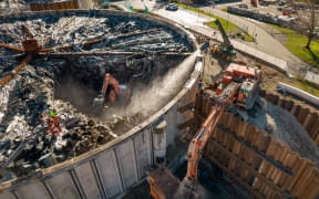Diggers working at the burnt-out Bromley wastewater treatment plant. Christchurch City Council supplied pictures and video of work to remove rot from inside its filters on 10 June 2022.
