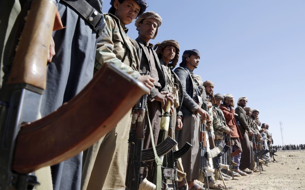 SANA'A, YEMEN - JANUARY 14: Houthi followers protest to condemn the U.S.-U.K. during a tribal gathering on January 14, 2024 on the outskirts of Sana'a, Yemen. Houthi followers gathered to protest against the U.S.-U.K. airstrikes on positions in areas under their control. (Photo by Mohammed Hamoud/Getty Images)