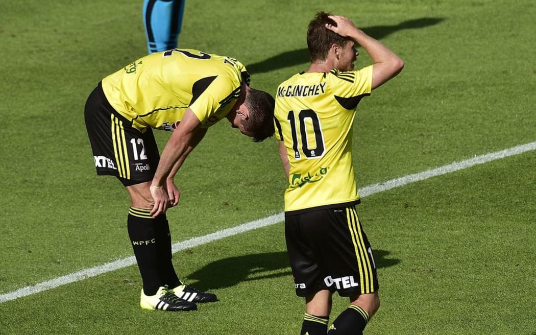 A dejected Blake Powell (L) with Phoenix team-mate Michael McGlinchey after a missed shot at goal against the Perth Glory at Westpac Stadium, Sunday the 07 February 2016. Copyright Photo by Marty Melville / www.Photosport.nz