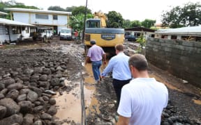 Assessing the damage after severe storms caused flooding across Tahiti.