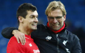 Liverpool defender Dejan Lovren and Liverpool manager Jurgen Klopp celebrate.