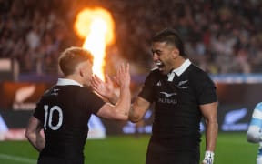 All Blacks Damian McKenzie scores a try and celebrates with Rieko Ioane.