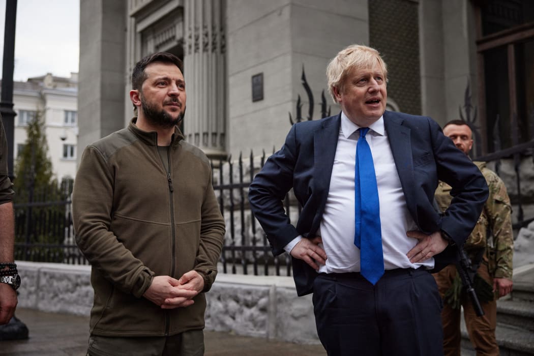 British Prime Minister Boris Johnson (R) and Ukrainian President Volodymyr Zelensky (L) speaking after walking in central Kyiv, on 9  April 2022.