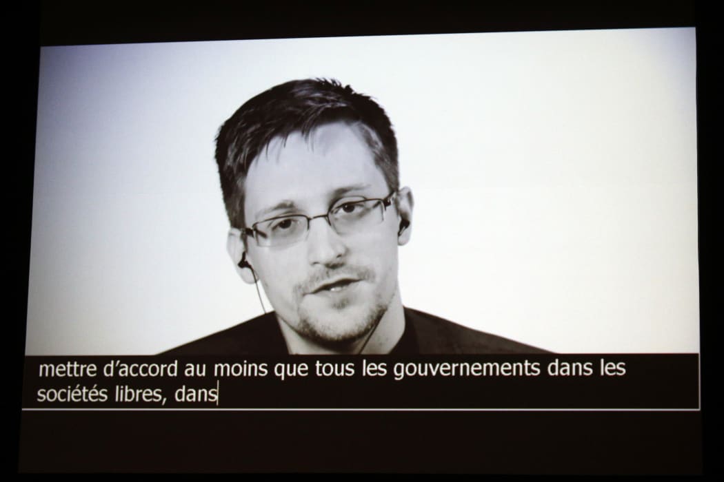 In this file photo taken on July 05, 2017 US intelligence contractor and whistle blower Edward Snowden delivers a speech by video conference during a masterclass at the Maison de la Radio, in Paris.