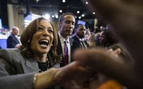 US Vice President and Democratic presidential candidate Kamala Harris greets supporters after speaking during a campaign rally at Lakewood Amphitheatre in Atlanta, Georgia, October 19, 2024. (Photo by CHRISTIAN MONTERROSA / AFP)