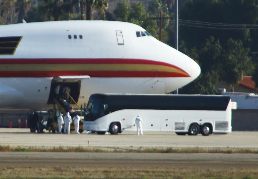 Some 200 US citizens evacuated from Wuhan were met on the tarmac by emergency vehicles and three buses at Riverside, California on January 29, 2020.