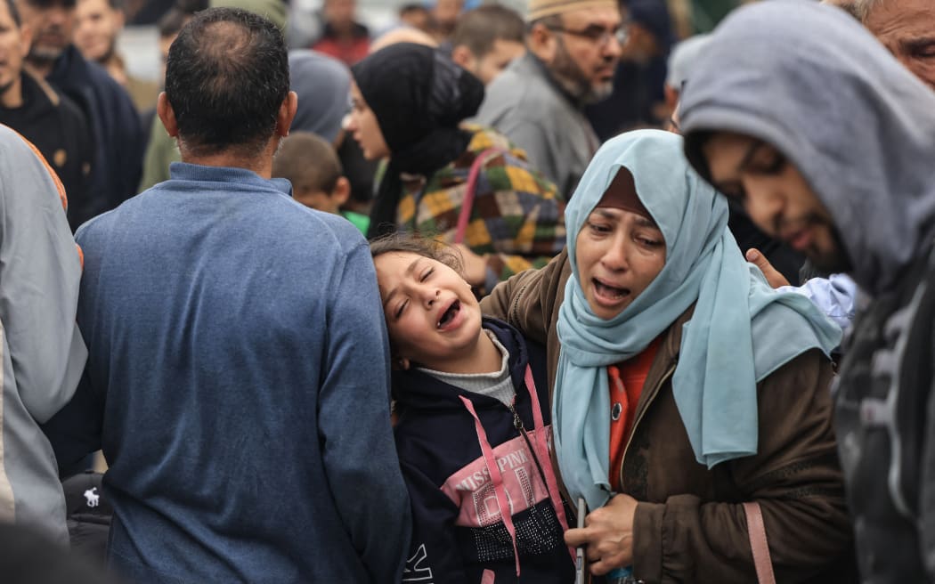 Palestinians mourn the death of loved ones following Israeli bombardment  in the southern Gaza Strip on December 5, 2023, outside a hospital in Khan Yunis, amid continuing battles between Israel and the militant group Hamas.