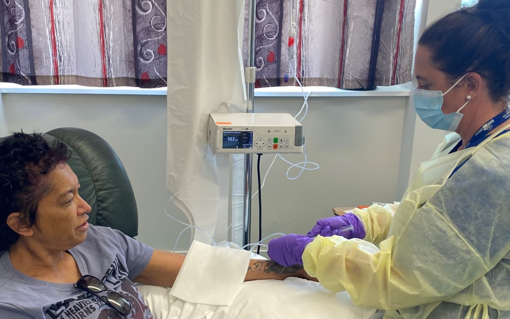 Rural Nurse Specialist Nerys Williams administering chemotherapy treatment to patient Mel Pomana.