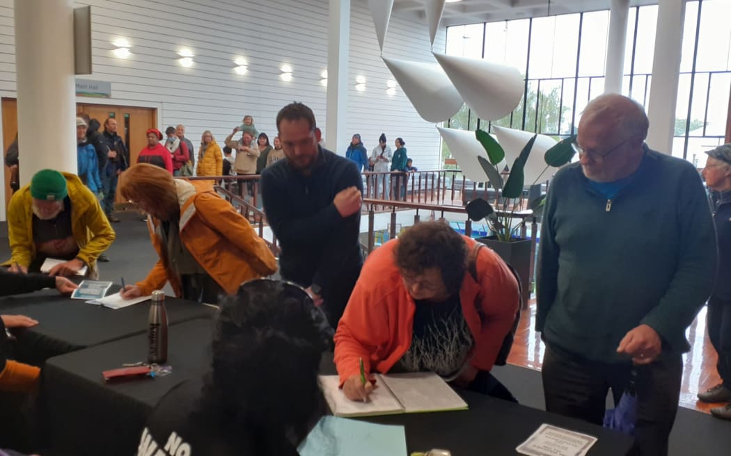 A long queue formed to sign a petition against the water consent granted to Aquifer 182 Holding Company Ltd.