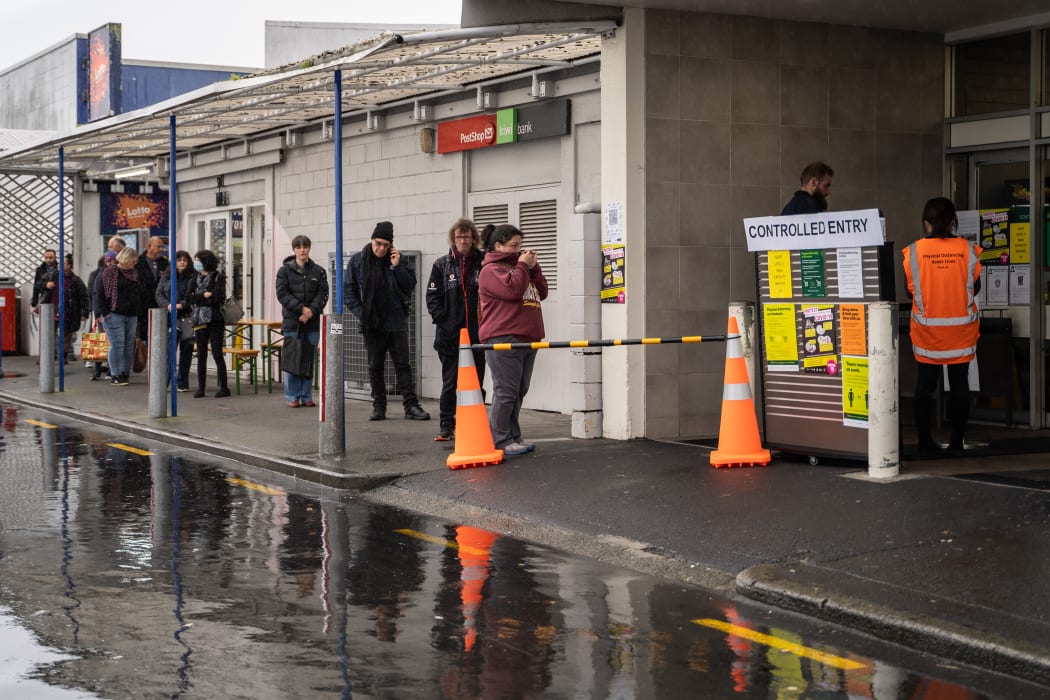 Shoppers queue to enter Point Chevalier Countdown in Auckland ahead of level 3 Covid-19 restrictions being imposed in the region at midday on 12 August 2020.