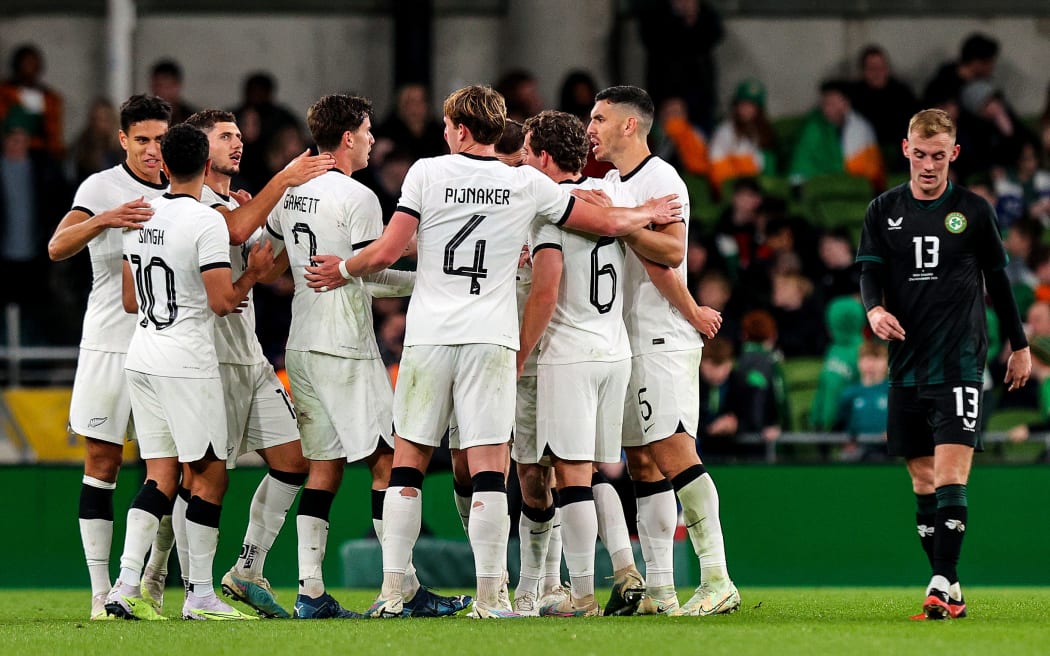 New Zealand players celebrate after Matt Garbett scores a goal against Ireland. 2023.