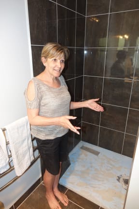 Nelson's Faye Gurr says the faulty shower in her home looks likely to cost about $10,000 to fix. She says building consents are not worth the paper they're written on.