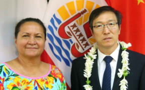 China’s Consul in French Polynesia, Tian Lixiao (R), poses with French Polynesia’s Vice-President Eliane Tevahitua.