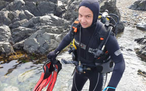 Green co-leader James Shaw goes scuba diving at Taputeranga marine reserve in Island Bay, Wellington, hoping to promote the party's marine policy.