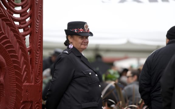 A Māori warden overseeing one of the gates into Tuurangawaewae during the tangi of Kiingi Tuheitia.