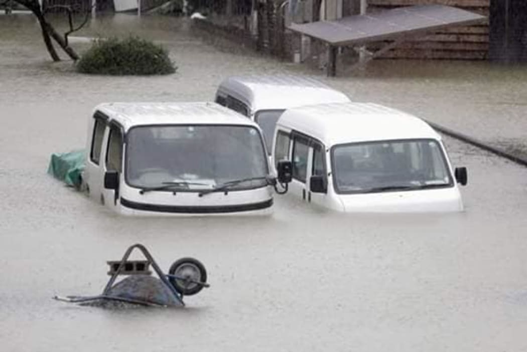 Vehicles submerged in water in Noda City, Chiba.