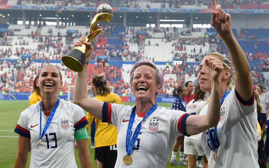 USA's players including forward Megan Rapinoe the World Cup title win.