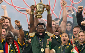 Siya Kolisi (captain) of South Africa lifts the Rugby World Cup Trophy to celebrate winning the final. Rugby World Cup France 2023, New Zealand All Blacks v South Africa FInal match at Stade de France, Saint-Denis, France on Saturday 29 October 2023. Photo credit: Andrew Cornaga / www.photosport.nz