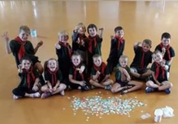 A group of Keas - an offshoot of Scouts - collects the bread tags for the charity