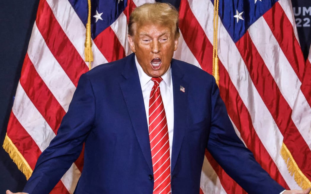 Former US President and Republican presidential hopeful Donald Trump arrives for a "Commit to Caucus" rally in Clinton, Iowa, on January 6, 2024. (Photo by TANNEN MAURY / AFP)