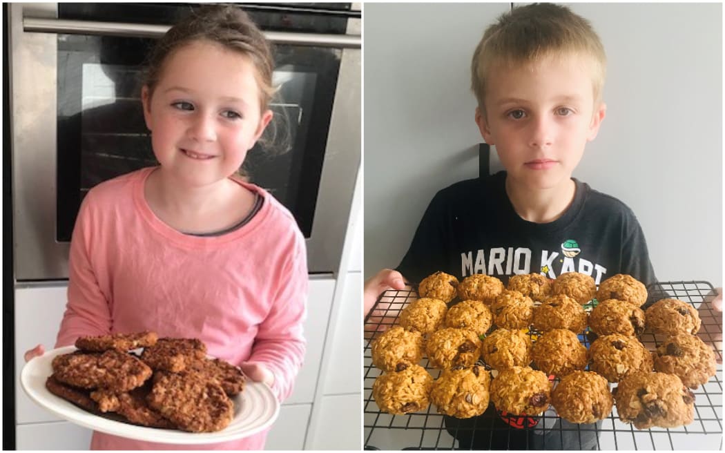 Izzy Prendergast and Harry Carr with Anzac biscuits they made