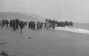 Lifeboat from the Wahine landing passengers and crew on Seatoun beach, 10 April 1968, photographed by an Evening Post staff photographer.