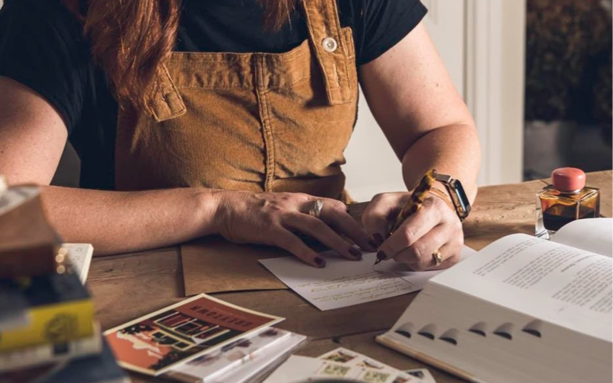 Millie Blackwell, writing a letter.