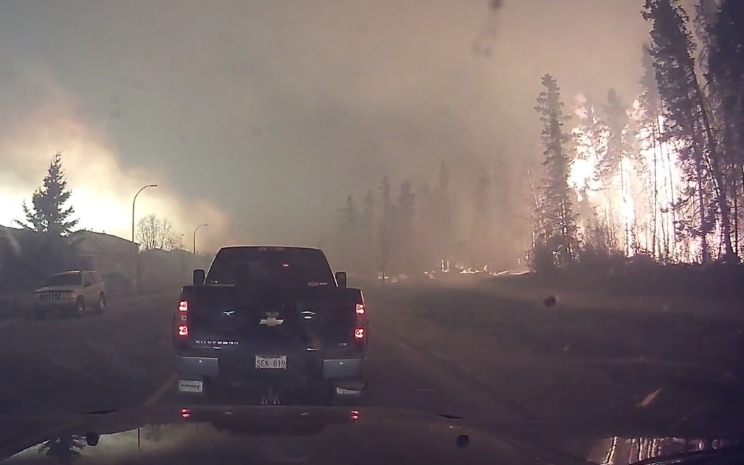 A dashcam video of residents evacuating the Canadian city of Fort McMurray Fire  during a massive forest fire.