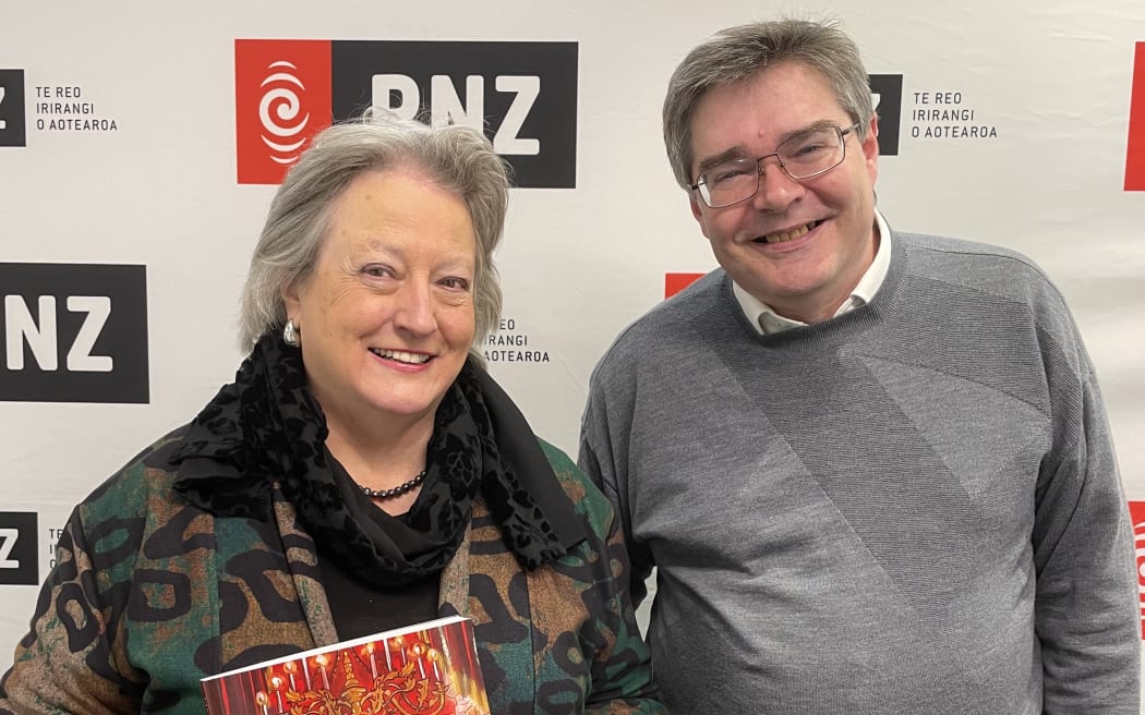 Patricia Hurley with her book Viva Opera! Standing beside host David Morriss
