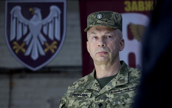 (FILES) This handout photograph taken and released by the Ukrainian Presidential Press Service on October 4, 2024, shows Commander-in-Chief of the Armed Forces of Ukraine Oleksandr Syrsky visiting the 82nd Air Assault Brigade at an undisclosed location in the Sumy region, amid the Russian invasion of Ukraine. Ukrainian President Volodymyr Zelensky said on July 21, 2026 that he was dismissing Oleksandr Syrsky, commander-in-chief of Ukraine's army, and appointing joint forces commander Mykhailo Drapaty in his place. (Photo by Handout / UKRAINIAN PRESIDENTIAL PRESS SERVICE / AFP) / XGTY / RESTRICTED TO EDITORIAL USE - MANDATORY CREDIT "AFP PHOTO / UKRAINIAN PRESIDENTIAL PRESS SERVICE" - NO MARKETING NO ADVERTISING CAMPAIGNS - DISTRIBUTED AS A SERVICE TO CLIENTS