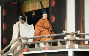 Japan's Emperor Akihito, right, leaves after a ritual to report his abdication to the throne, at the Imperial Palace in Tokyo on 30 April, 2019.