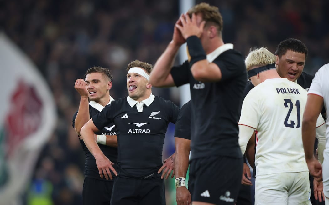 (L-R) Cortez Ratima, Damian McKenzie and Sam Darry show their dejection at the final whistle of their loss to England.